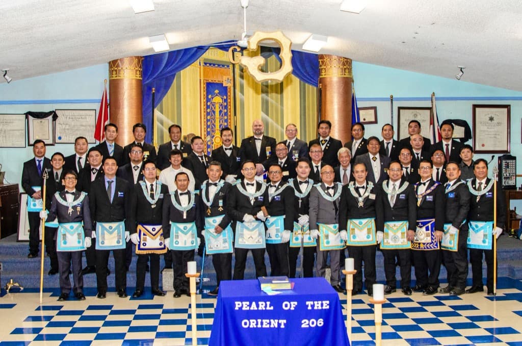 Members of Pearl of the Orient Lodge No. 206 gathered in the lodge room.