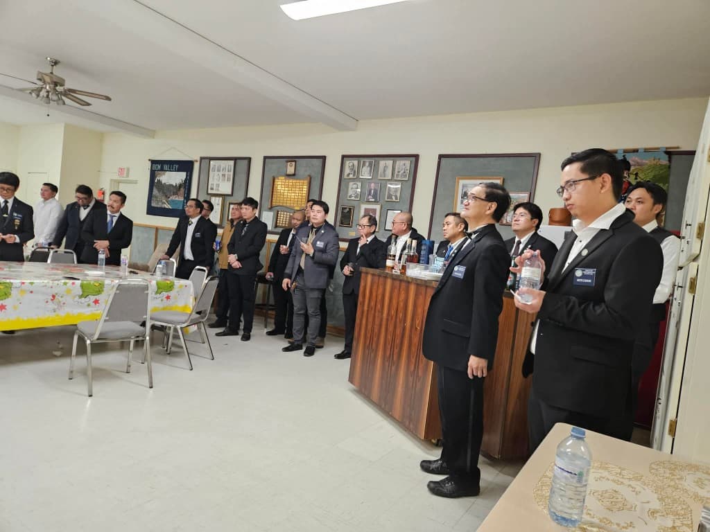 Brethren of Pearl of the Orient Lodge No. 206 gathered in fellowship after a meeting at the Festive Board.